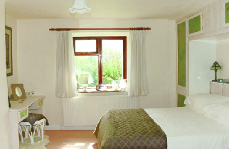 Bedroom with en-suite bath and king-size bed